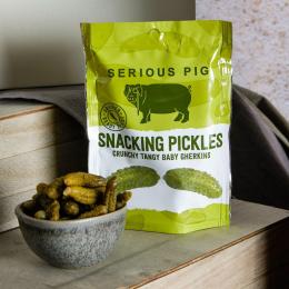 Serious Pig snacking pickles